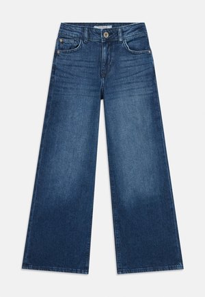 Blue denim wide-leg jeans with front and coin pockets, button closure, and subtle fade details on the thighs and knees.