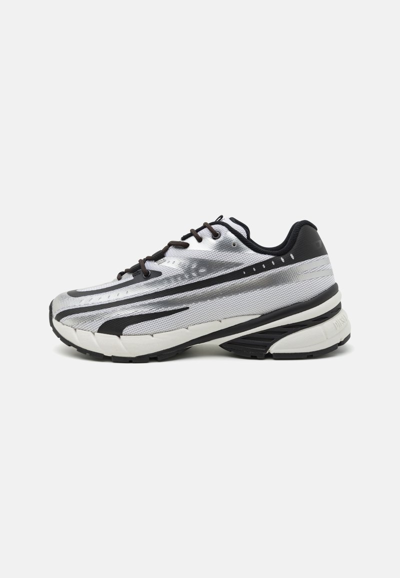 Running shoe with a silver mesh upper, black accents, and white sole. Features textured design and black laces. Lightweight and cushioned.