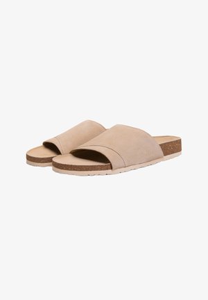 Sandalias beige de ante con punta abierta, sin cierre, con plantillas de corcho y suelas de goma de color claro, mostradas lado a lado sobre un fondo blanco.