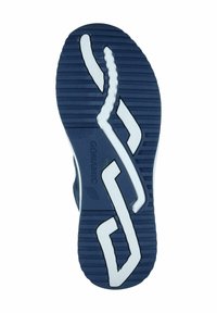 Sole of a shoe featuring a navy blue rubber material with white accents, curved grooves for traction, and a unique cut-out pattern.