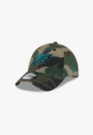Camouflage baseball cap featuring a turquoise embroidered eagle logo, classic bill shape, adjustable strap, and textured fabric.