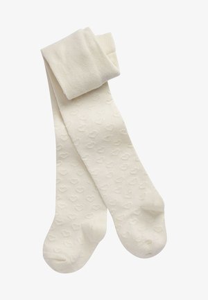Collants ivoire avec un motif texturé de petits cœurs, fabriqués à partir d'un matériau doux, avec une taille lisse et un design de chaussure arrondi.