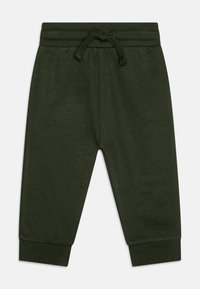 Σκούρο πράσινο παντελόνι φόρμας από μαλακό βαμβάκι, με ραμμένα μανίκια στη μέση και ρυθμιζόμενο κορδόνι και στενά μπατζάκια στους αστραγάλους.