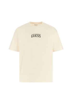 Short-sleeve, cream t-shirt made of cotton with a relaxed fit, featuring a black "GUESS" logo and text on the front.