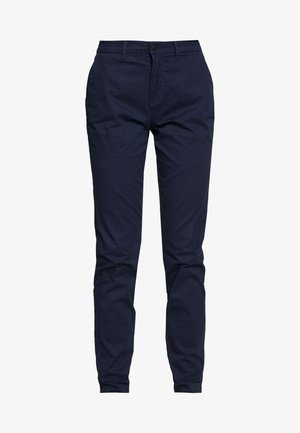 Navy blue chinos made from cotton, featuring a slim fit, front pockets, and a single button closure at the waist. Smooth texture.