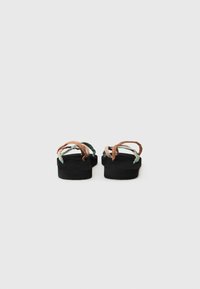 Black platform sandals with thin straps in brown and green. The footbed features a textured finish, enhancing grip and comfort.