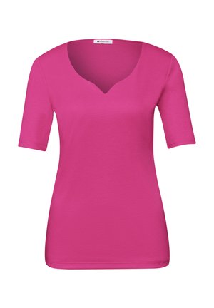 Maglietta a maniche corte di un rosa acceso con un delicato scollo a V a forma di intaglio, taglio aderente e tessuto liscio.