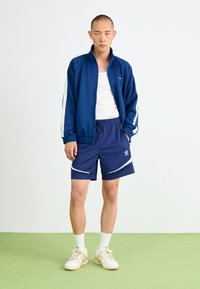 adidas Originals ARCHIVE - Teplákové kalhoty - dark blue/white