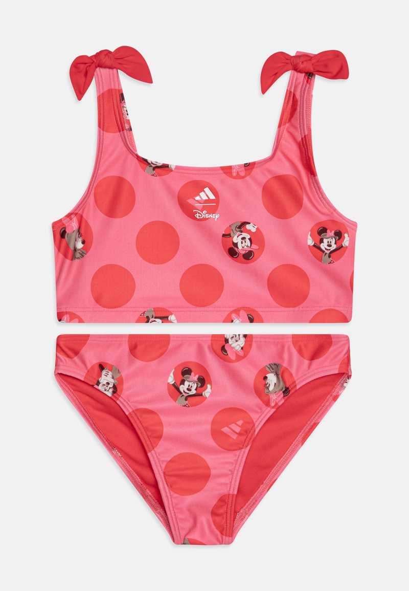 Costume da bagno due pezzi rosa con motivo a pois circolari e grafiche di Minnie Mouse. Fiocchi rossi regolabili sulle spalline. Texture liscia.