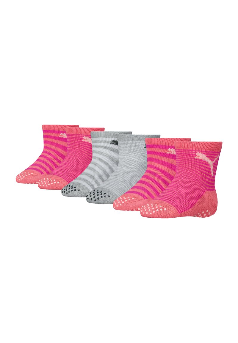 Tre paia di calzini da lavoro: rosa con design a tinta unita e a righe, grigi a righe, e con grip in gomma sulle suole. Cuffie elastiche a coste.