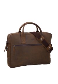 Malette en cuir marron avec doubles poignées, poche zippée à l'avant et bandoulière détachable en cuir marron foncé avec des clous en métal.