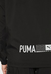 Puma Laufjacke - black