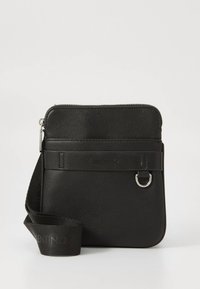 Black synthetic crossbody bag with a zippered top, flat front pocket, textured surface, and adjustable strap featuring a logo detail.