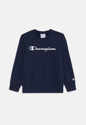 Granatowa bluza z bawełny z logo "Champion" w kolorze białym na klatce piersiowej oraz małym logo na rękawie. Okrągły dekolt.