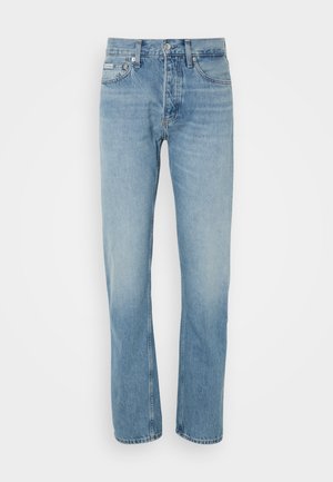 Heledad sinised teksad sirge säärega disainiga, viie tasku ja nööbi ning tõmbluku kinnitusega. Omab õhukest pleekimist ja sangitud detaile.