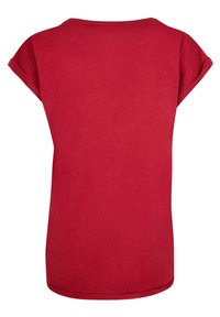 Rød t-shirt med rund halsudskæring, korte, opdæmpede ærmer og en løs pasform. Blødt bomuldsstof med en glat overflade og uden synlige mønstre.