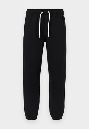 Pantaloni de trening negri cu șnur alb, talie elastică și manșete elastice.
