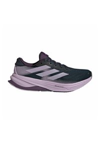 Scarpe da corsa con una tomaia in rete verde scuro, accenti viola, tre strisce bianche e un logo rosa sulla linguetta. Design della suola ammortizzata.