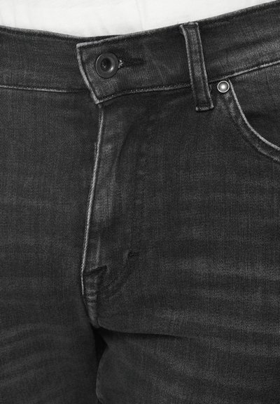 Jeans negri din denim, cu un design clasic cu cinci buzunare, închidere cu nasture și cusături contrastante pe talie și buzunare.