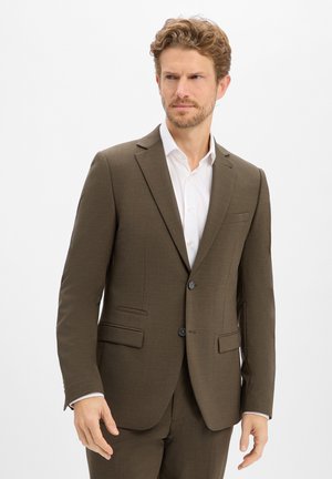 Brown suit jacket with a textured finish, two front pockets, and single button closure. Worn over a white shirt, featuring a notched lapel.