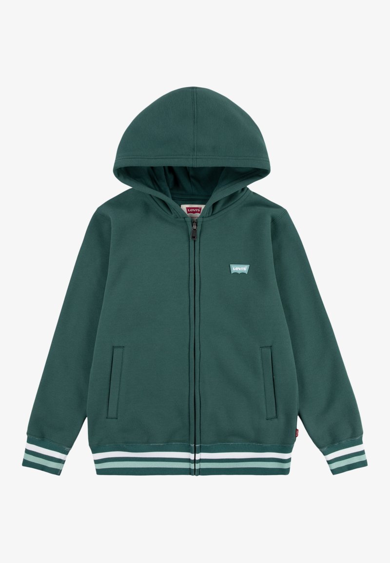 Felpa verde con zip realizzata in materiale morbido. Caratterizzata da un cappuccio, due tasche laterali e accenti a righe bianche e blu sui polsini e sull'orlo.