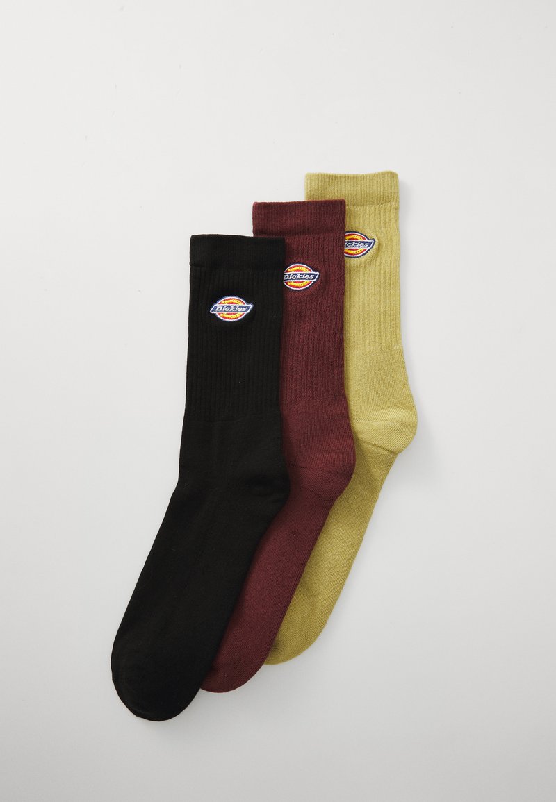 Tre par strumpor i svart, vinröd och senapsgul. Ribbad textur med cirkulär Dickies-logotyp på varje strumpa.
