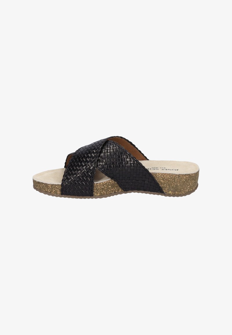 Black woven slide sandal with cross-over design, cushioned beige insole, and textured cork outer sole. Lightweight and casual style.