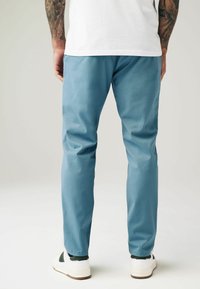 Next SLIM FIT STRETCH - Chino hlače - light blue