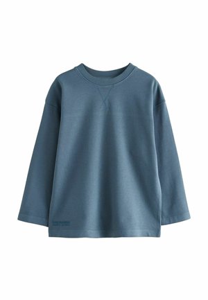 Pitkähihaine sininen huppari tekstuurimateriaalista, jossa on pyöreä pääntie ja näkyvät ompelureunat. Mukana pieni painettu etiketti helmassa.