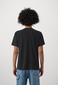 Rip Curl FADE OUT TEE UNISEX - Osnovna majica kratkih rukava - black