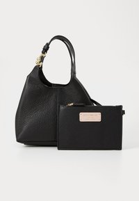 Black textured leather handbag with a rounded shape, short handle, and gold-tone hardware; includes a matching leather pouch with a logo plate.