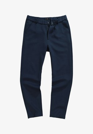Navy blue tapered pants made from a smooth fabric, featuring side pockets, a zip fly, and a button closure.