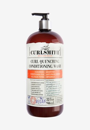 32 fl oz amber fles met pomp. Etiket bevat zwart-wit tekst met details over ingrediënten en voordelen. Vegan en cruelty-free symbool inbegrepen.