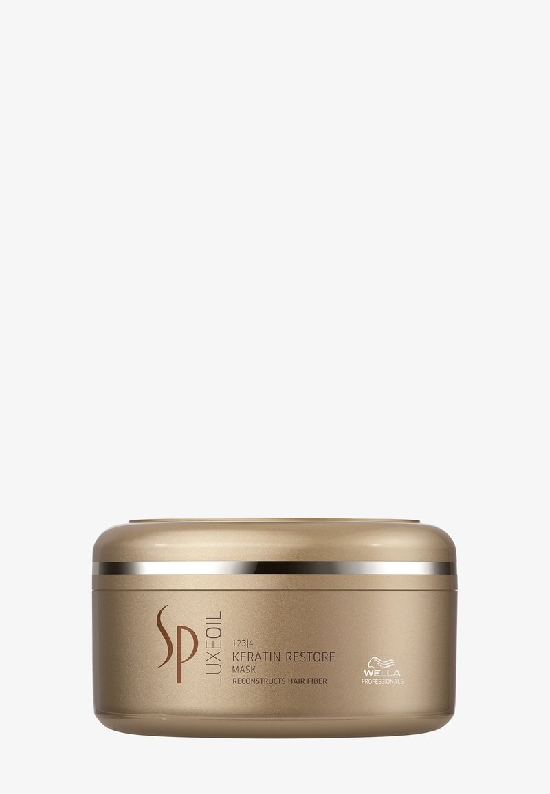 Contenant du masque capillaire SP Luxe Oil Keratin Restore en or avec texte noir et logo Wella Professionals sur fond blanc.