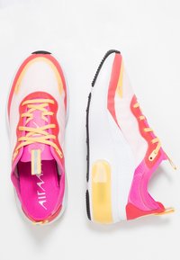 Nike sneakers featuring a lightweight, mesh upper in white, pink, and orange with a yellow accent, cushioned sole, and visible air unit.