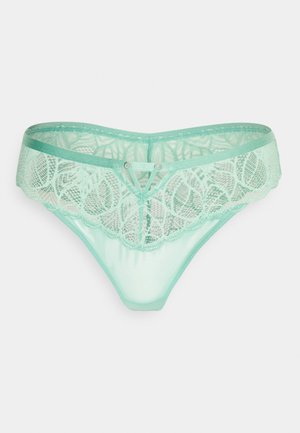 Perizoma in pizzo verde menta con intricati motivi floreali, una parte frontale semi-trasparente e una cintura liscia ed elastica. Accentua un design a V.