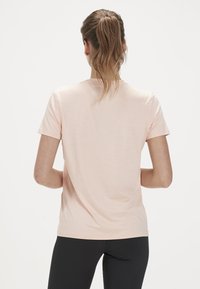 Endurance WANGE MELANGE - Sport T-Shirt - dusty peach