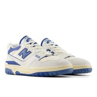 White and blue athletic sneakers with a suede and mesh upper, featuring a prominent "N" logo, flat laces, and a rubber sole.