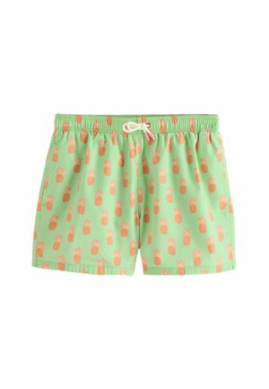 Short de bain vert clair avec une ceinture élastique et un cordon blanc, orné de petits ananas orange.