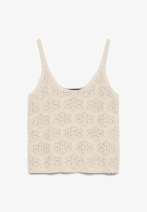 Débardeur en maille crochet couleur crème avec motifs floraux en œillets et fines bretelles, détail d'ourlet festonné.