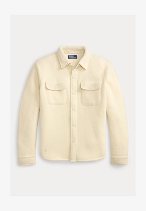 Giacca camicia in lana color crema a maniche lunghe con bottoni, due tasche a patta frontali e colletto, etichetta Polo Ralph Lauren all'interno del colletto.