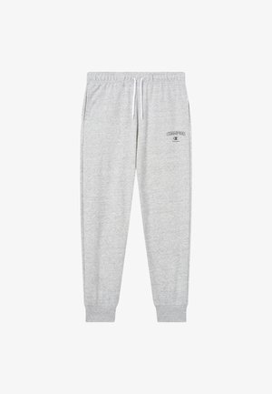 Pantalon de survêtement gris clair en tissu doux, doté d'une taille élastique avec cordons de serrage et d'un petit logo noir sur la cuisse gauche.