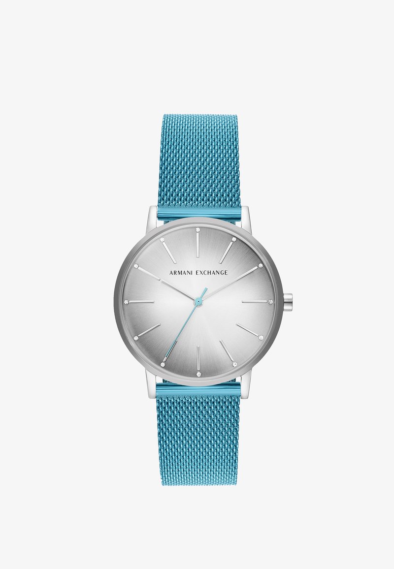 Silverfärgad klocka med rund urtavla, en metallnätarmband i turkos, minimalistisk design och kristallmarkeringar på en grå gradienttavla.