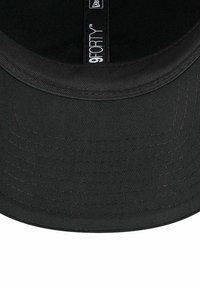 Black cap with a curved visor, constructed from durable fabric. Features tonal stitching and a label reading "9FORTY" inside the band.