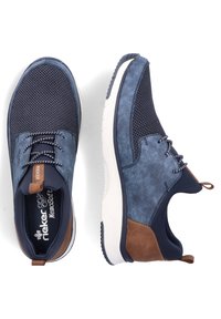 Navy blue sneakers with mesh and synthetic leather upper, contrasting brown accents, round toe, lace-up design, and textured rubber sole.