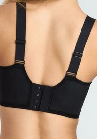 Czarny biustonosz z regulowanymi ramiączkami, zapięciem na haftki z tyłu oraz usztywnionymi miseczkami dla wsparcia. Gładka tekstura i minimalistyczny design.