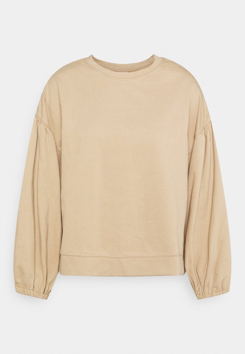 Sweat-shirt beige à col rond, en coton doux, coupe décontractée, manches longues avec poignets froncés, et ourlet droit.