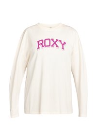 Camiseta de manga larga color crema con un prominente logo rosa de "ROXY". Elaborada con tejido suave, tiene un ajuste relajado y un diseño de hombro caído.