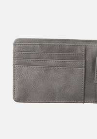 Gray leather wallet featuring multiple card slots and textured surface. Edges are stitched for durability. Compact and rectangular design.