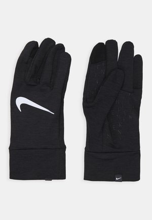 Guantes negros de tejido suave, con un logo blanco de Nike y un agarre texturizado en las palmas, que ofrecen un ajuste ceñido y puños extendidos.